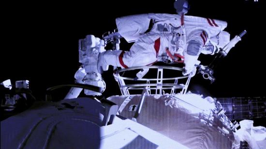 Astronaut Liu Boming steps out of core module of the China’s new space station on Sunday. (AP)