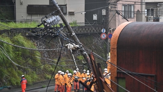 Firefighters work at the scene of a landslide following days of heavy rain in Atami in Shizuoka Prefecture on July 4, 2021.(AFP) Firefighters work at the scene of a landslide following days of heavy rain in Atami in Shizuoka Prefecture on July 4, 2021.(AFP)
