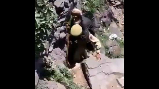 An SPO carrying an elderly man in Jammu and Kashmir. (Twiiter/@DrJitendraSingh)