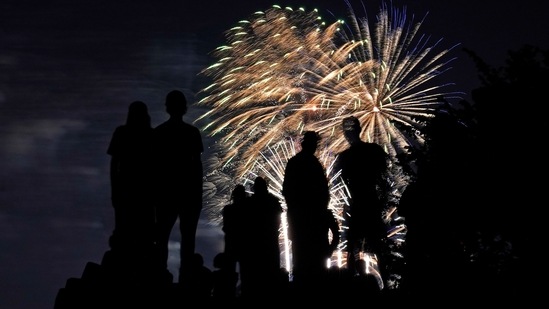Last July Fourth she watched fireworks from her apartment building's rooftop while under pandemic lockdown, allowed to celebrate with only her immediate family. (AP)