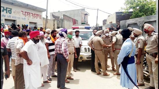 A police team at Ballarwal village of Batala in Gurdaspur district where the incident took place on Sunday. (HT photo)