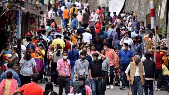Tourists and locals visit a crowded market area following ease in COVID-induced restrictions in Shimla on Saturday.((Deepak Sansta/HT))