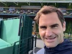 Roger Federer walking around the Wimbledon club and grass courts during Middle Sunday and sends out a message for his fan.