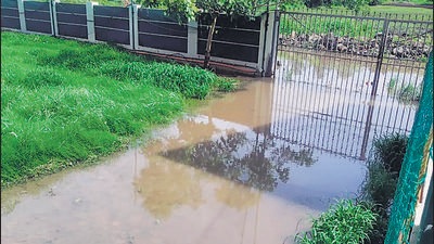 A flooded compound near Suyog Nisarg on Sunday. (HT PHOTO) A flooded compound near Suyog Nisarg on Sunday. (HT PHOTO)