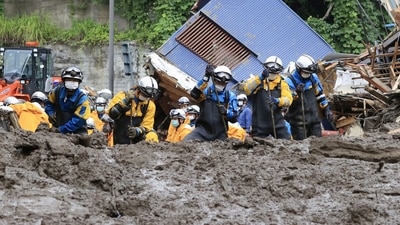 In addition to the four people found dead, officials said 25 people have been rescued, including three who were injured. In picture - Police officers conduct a rescue and search operation at Izusan district in Atami, Japan. (Reuters)