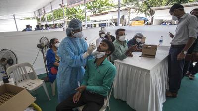 Health workers collect swab samples for Covid-19 test ahead of the monsoon session at Vidhan Bhavan in Mumbai on Saturday, July 3. (HT photo) Health workers collect swab samples for Covid-19 test ahead of the monsoon session at Vidhan Bhavan in Mumbai on Saturday, July 3. (HT photo)