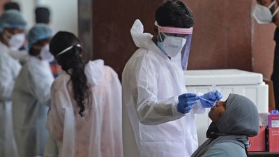 Experts and the World Health Organization (WHO) recommend a test positivity rate below 5% for at least two weeks in a region for an outbreak to be considered under control. (AFP) Experts and the World Health Organization (WHO) recommend a test positivity rate below 5% for at least two weeks in a region for an outbreak to be considered under control. (AFP)