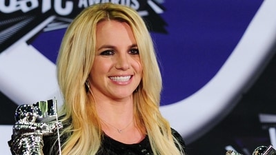 Britney Spears holds her Best Pop Video Award and her Michael Jackson Video Vanguard Award at the 2011 MTV Video Music Awards. (AFP File Photo)