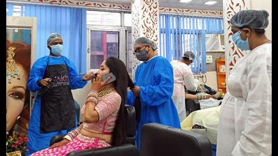 Parlour owners in Delhi-NCR say they are packed, but claim that Covid-19 gear is costing them quite a lot. Parlour owners in Delhi-NCR say they are packed, but claim that Covid-19 gear is costing them quite a lot.