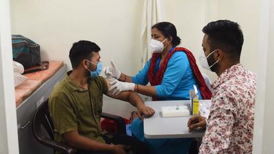A health worker administers a dose of Covid-19 vaccine in Gurugram in Haryana (Vipin Kumar/HT PHOTO)