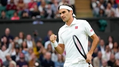 Switzerland's Roger Federer celebrates winning the first set against Italy's Lorenzo Sonego during the men's singles fourth round match on day seven of the Wimbledon. (AP)