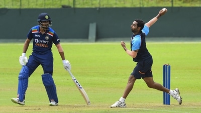 Manish Pandey (left) watches on as Bhuvneshwar Kumar, fondly known as Bhuvi (right) bowls during India's intra-squad match. (BCCI/TWITTER)