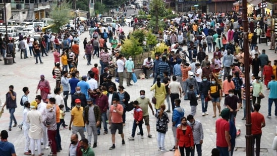 Tourists gather at Mall Road after the relaxation in COVID-19 restrictions, in Manali. ((ANI Photo))