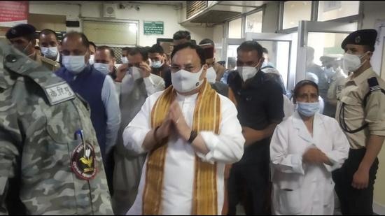 BJP president JP Nadda and chief minister Jai Ram Thakur visiting veteran Congress leader and former chief minister Virbhadra Singh at Indira Gandhi Medical College and Hospital in Shimla on Monday. (HT Photo)