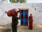 A worker delivers an LPG cylinder to a village home in Greater Noida.(Bloomberg Photo) A worker delivers an LPG cylinder to a village home in Greater Noida.(Bloomberg Photo)