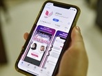 A woman holds an Apple iPhone device showing on its App Store an app for facilitating "Misyar" marriage, available in Saudi Arabia, in the capital Riyadh. A woman holds an Apple iPhone device showing on its App Store an app for facilitating "Misyar" marriage, available in Saudi Arabia, in the capital Riyadh.