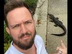 The image shows pastor Daniel Gregory of Victory church taking a selfie with the alligator.(Facebook/@Daniel Gregory) The image shows pastor Daniel Gregory of Victory church taking a selfie with the alligator.(Facebook/@Daniel Gregory)