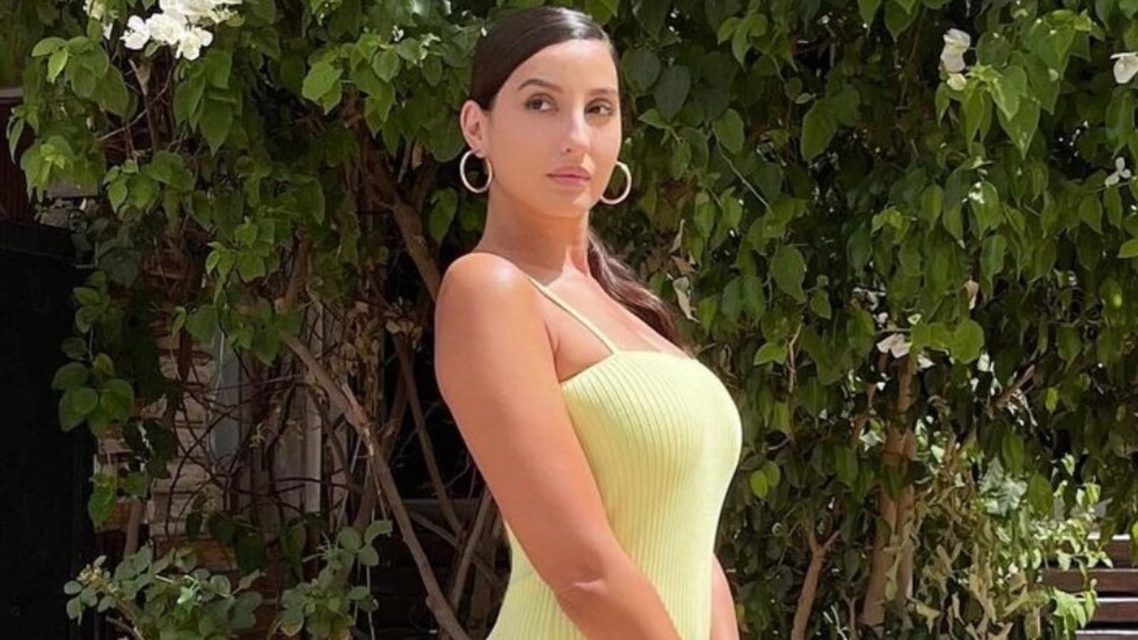 Nora Fatehi pairs sexy neon yellow bodycon dress with â‚¹3 lakh bag for shoot  | Fashion Trends - Hindustan Times