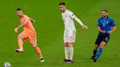 Spain's goalkeeper Unai Simon, left, kicks the ball away as teammate Aymeric Laporte watches with Italy's Domenico Berardi, right, during the Euro 2020 soccer championship semifinal between Italy and Spain at Wembley stadium in London, Tuesday, July 6, 2021. (AP Photo/Matt Dunham,Pool) (AP) Spain's goalkeeper Unai Simon, left, kicks the ball away as teammate Aymeric Laporte watches with Italy's Domenico Berardi, right, during the Euro 2020 soccer championship semifinal between Italy and Spain at Wembley stadium in London, Tuesday, July 6, 2021. (AP Photo/Matt Dunham,Pool) (AP)