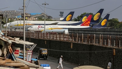 Jet Airways India Ltd. and a SpiceJet Ltd. aircraft at Chhatrapati Shivaji Maharaj International Airport in Mumbai, India, on Wednesday, May 26, 2021. (Bloomberg)