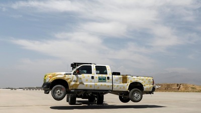 A forklift carries a vehicle in Bagram air base, after American troops vacated it, in Parwan province on July 5. On July 4, hundreds of members of the Afghan security forces fled to refuge in neighbouring Tajikistan. (Mohammad Ismail / REUTERS) A forklift carries a vehicle in Bagram air base, after American troops vacated it, in Parwan province on July 5. On July 4, hundreds of members of the Afghan security forces fled to refuge in neighbouring Tajikistan. (Mohammad Ismail / REUTERS)