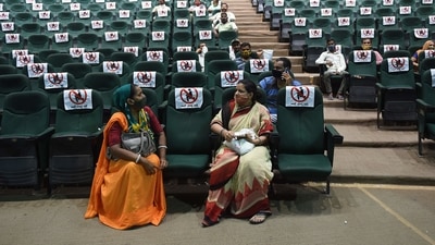 People sit after getting a dose of the Covishield vaccine against the Covid-19 coronavirus during a vaccination drive at Tagore Hall in Ahmedabad on July 6, 2021. (AFP) People sit after getting a dose of the Covishield vaccine against the Covid-19 coronavirus during a vaccination drive at Tagore Hall in Ahmedabad on July 6, 2021. (AFP)