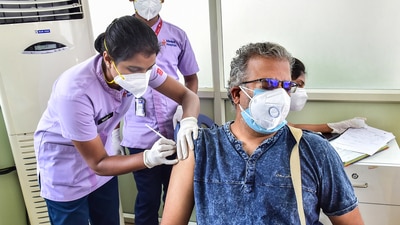 A medic administers a dose of Sputnik V vaccine to a beneficiary during its launch in Bengaluru. (PTI File Photo)