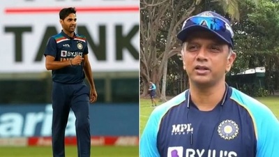 Bhuvneshwar Kumar (L) hails Rahul Dravid (R) (HT Collage)