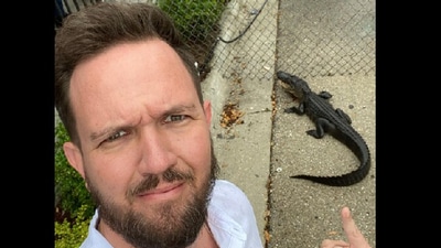 The image shows pastor Daniel Gregory of Victory church taking a selfie with the alligator. (Facebook/@Daniel Gregory)