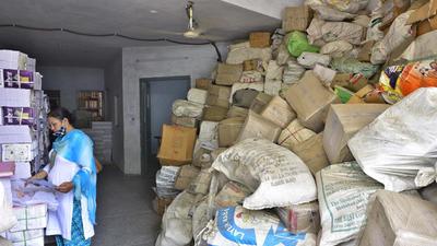 Booklets and answer sheets dumped at the entrance of Punjab School Education Board depot in Ludhiana on Tuesday. (Gurpreet Singh/HT)