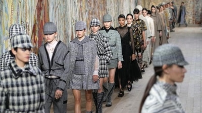 Models wear creations for Dior's Haute Couture Fall-Winter 2021-2022 fashion collection (AP) Models wear creations for Dior's Haute Couture Fall-Winter 2021-2022 fashion collection (AP)