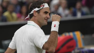 Switzerland’s Roger Federer celebrates after defeating Italy’s Lorenzo Sonego during the men's singles fourth round at Wimbledon on Monday. (AP) Switzerland’s Roger Federer celebrates after defeating Italy’s Lorenzo Sonego during the men's singles fourth round at Wimbledon on Monday. (AP)