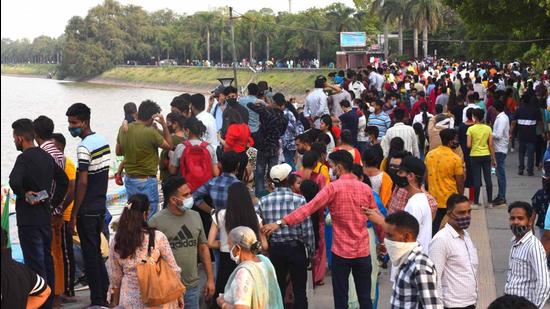 Visitors showing scant regard for social distancing at Sukhna Lake in Chandigarh. (Keshav Singh/HT)