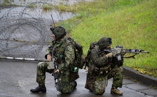 Japanese soldiers train during a joint military drill between Japan Self-Defense Forces, French Army and US Marines, at the Kirishima exercise area in Ebino, Miyazaki prefecture, Japan. (REUTERS) Japanese soldiers train during a joint military drill between Japan Self-Defense Forces, French Army and US Marines, at the Kirishima exercise area in Ebino, Miyazaki prefecture, Japan. (REUTERS)