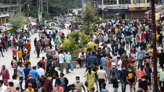 Tourists gather at Mall Road after the relaxation in COVID-19 restrictions, in Manali (ANI).