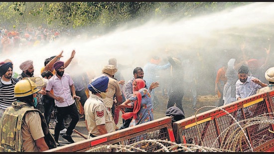 Chandigarh Police using water canons to stop contractual teachers from trying to march towards the residence of Punjab chief minister, near YPS Chowk in Sector 51 on Tuesday. (Keshav SIngh/HT) Chandigarh Police using water canons to stop contractual teachers from trying to march towards the residence of Punjab chief minister, near YPS Chowk in Sector 51 on Tuesday. (Keshav SIngh/HT)