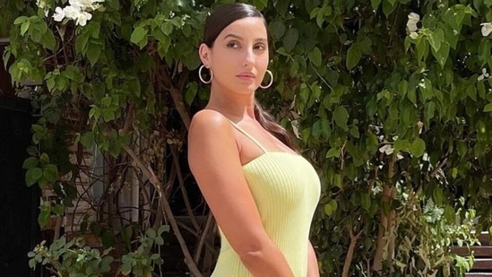 Nora Fatehi pairs sexy neon yellow bodycon dress with <span class='webrupee'>₹</span>3 lakh bag for shoot(Instagram/@norafatehi) Nora Fatehi pairs sexy neon yellow bodycon dress with <span class='webrupee'>₹</span>3 lakh bag for shoot(Instagram/@norafatehi)