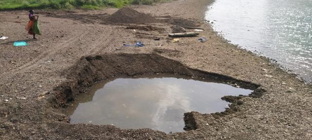 The irrigation officials on a site inspection found these huge holes on the river bed from where sand had been dredged. (HT) The irrigation officials on a site inspection found these huge holes on the river bed from where sand had been dredged. (HT)
