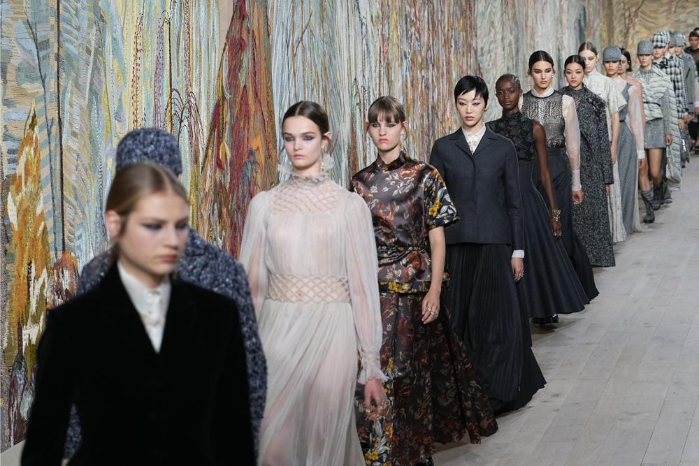 Models wear creations for Dior's Haute Couture Fall-Winter 2021-2022 fashion collection(AP)