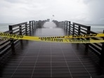 Dark clouds from Tropical Storm Elsa loom over Venice Fishing Pier at Brohard Park at Venice Beach, Florida, US, on July 6, 2021. 