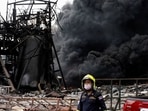 Emergency personnel looks on as smoke rises from a plastic factory after an explosion in Samut Prakan, outside Bangkok, Thailand. (Reuters) Emergency personnel looks on as smoke rises from a plastic factory after an explosion in Samut Prakan, outside Bangkok, Thailand. (Reuters)