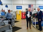 President of McHenry County College Clint Gabbard speaks as President Joe Biden tours a manufacturing lab at the college on Wednesday. President of McHenry County College Clint Gabbard speaks as President Joe Biden tours a manufacturing lab at the college on Wednesday.