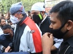 Amitabh Bachchan and Abhishek Bachchan at Dilip Kumar's funeral.