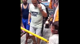 The image shows the little boy scolding people without masks in Dharamshala.