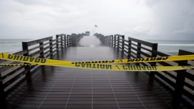 Dark clouds from Tropical Storm Elsa loom over Venice Fishing Pier at Brohard Park at Venice Beach, Florida, US, on July 6, 2021. (REUTERS/Octavio Jones)
