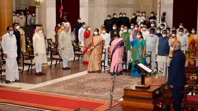 The newly sworn-in ministers, right, stand with Indian Prime Minister Narendra Modi, third left in the front row, and other senior ministers during swearing-in ceremony at the Rashtrapati Bhavan in New Delhi, India. (AP)