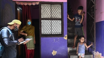 A volunteer (L) registers residents during a door-to-door drive to register people for vaccination against Covid-19 in New Delhi on July 6. Delhi was adding around 20,000 new cases each day till the first week of May, after which cases fell, on the back of a lockdown imposed in the capital from April 19. (Sajjad Hussain / AFP) A volunteer (L) registers residents during a door-to-door drive to register people for vaccination against Covid-19 in New Delhi on July 6. Delhi was adding around 20,000 new cases each day till the first week of May, after which cases fell, on the back of a lockdown imposed in the capital from April 19. (Sajjad Hussain / AFP)