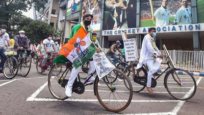 TMC MLAs Becharam Manna and Kalyan Ghosh with party workers ride bicycles to reach West Bengal Legislative assembly during a protest against fuel price hike, in Kolkata on July 7. (PTI) TMC MLAs Becharam Manna and Kalyan Ghosh with party workers ride bicycles to reach West Bengal Legislative assembly during a protest against fuel price hike, in Kolkata on July 7. (PTI)