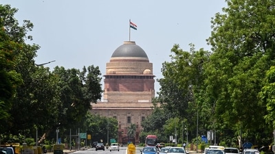 The national flag flutters on the Rashtrapati Bhawan as new ministers will take oath during the cabinet reshuffle in New Delhi. (AFP) The national flag flutters on the Rashtrapati Bhawan as new ministers will take oath during the cabinet reshuffle in New Delhi. (AFP)