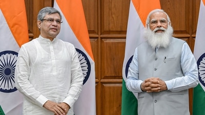 MP Ashwini Vaishnaw with Prime Minister Narendra Modi before taking oath at 7, Lok Kalyan Marg in New Delhi. (PTI)